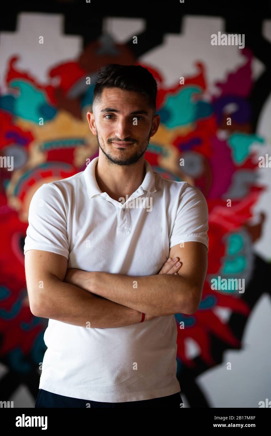 Man polo shirt arms crossed hi-res stock photography and images - Alamy