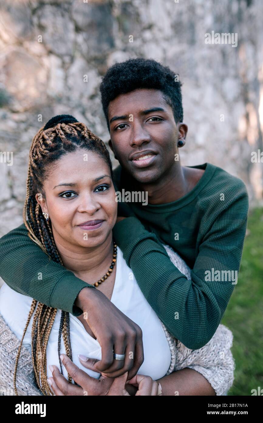 Portrait of smiling mother with teenage son outdoors Stock Photo