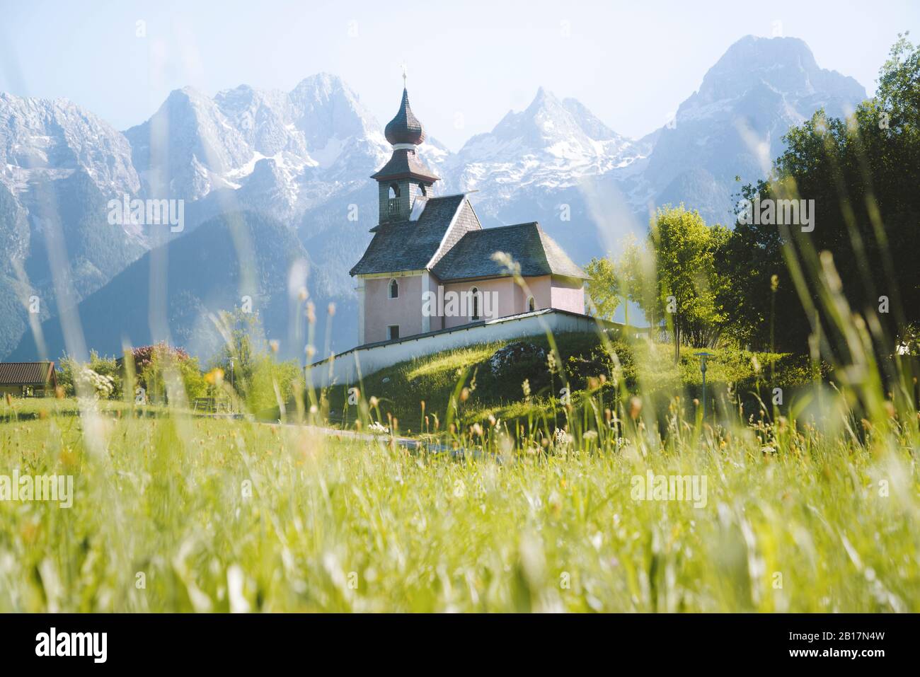 Austria, Salzburg Land, Lofer, Au church with Lofer mountains in background in springtime Stock Photo