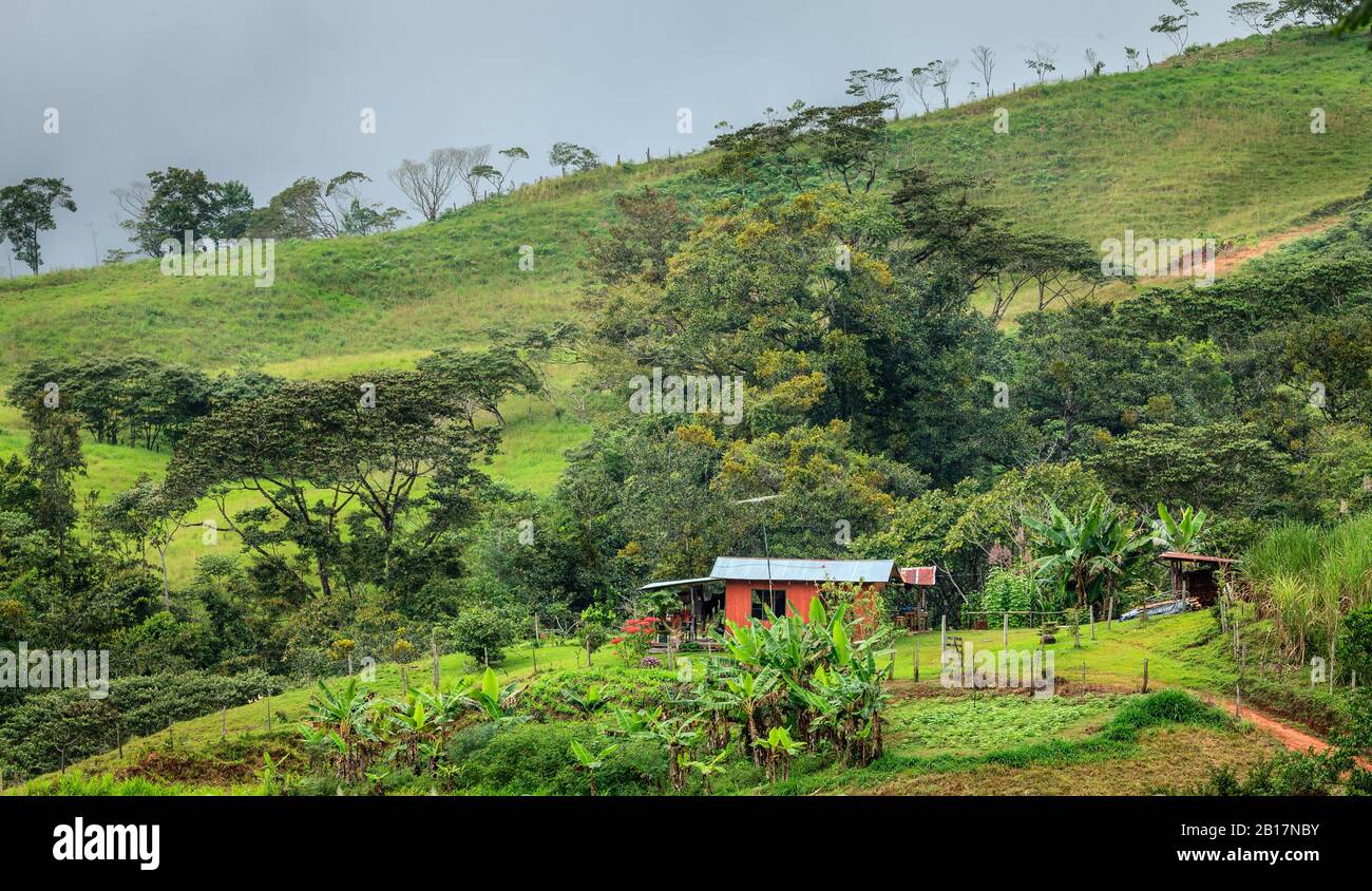 Farm house at the foot of a hill in central Costa Rica Stock Photo