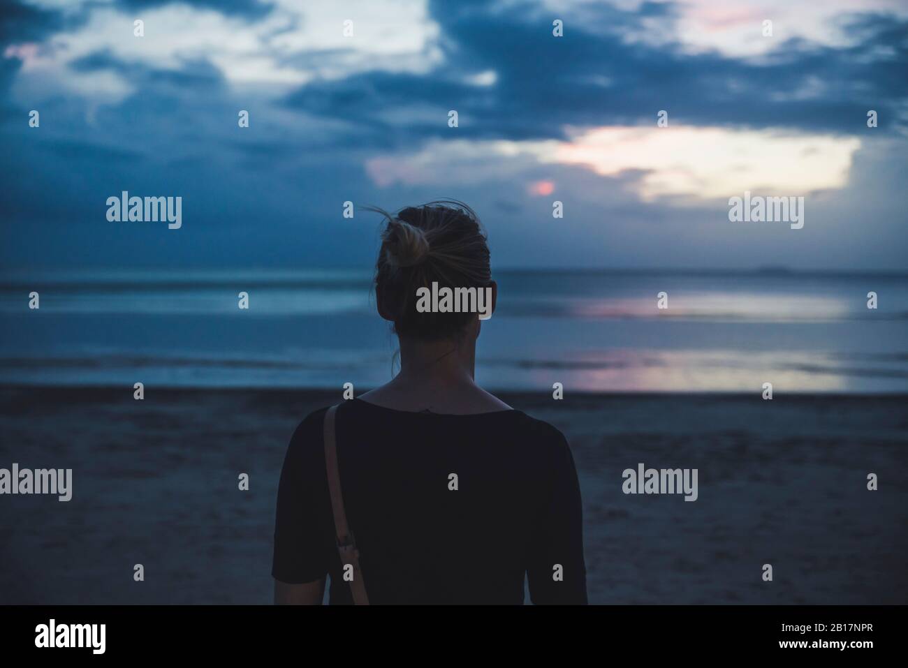 Rear view of woman on the beach at sunset, Koh Lanta, Thailand Stock Photo