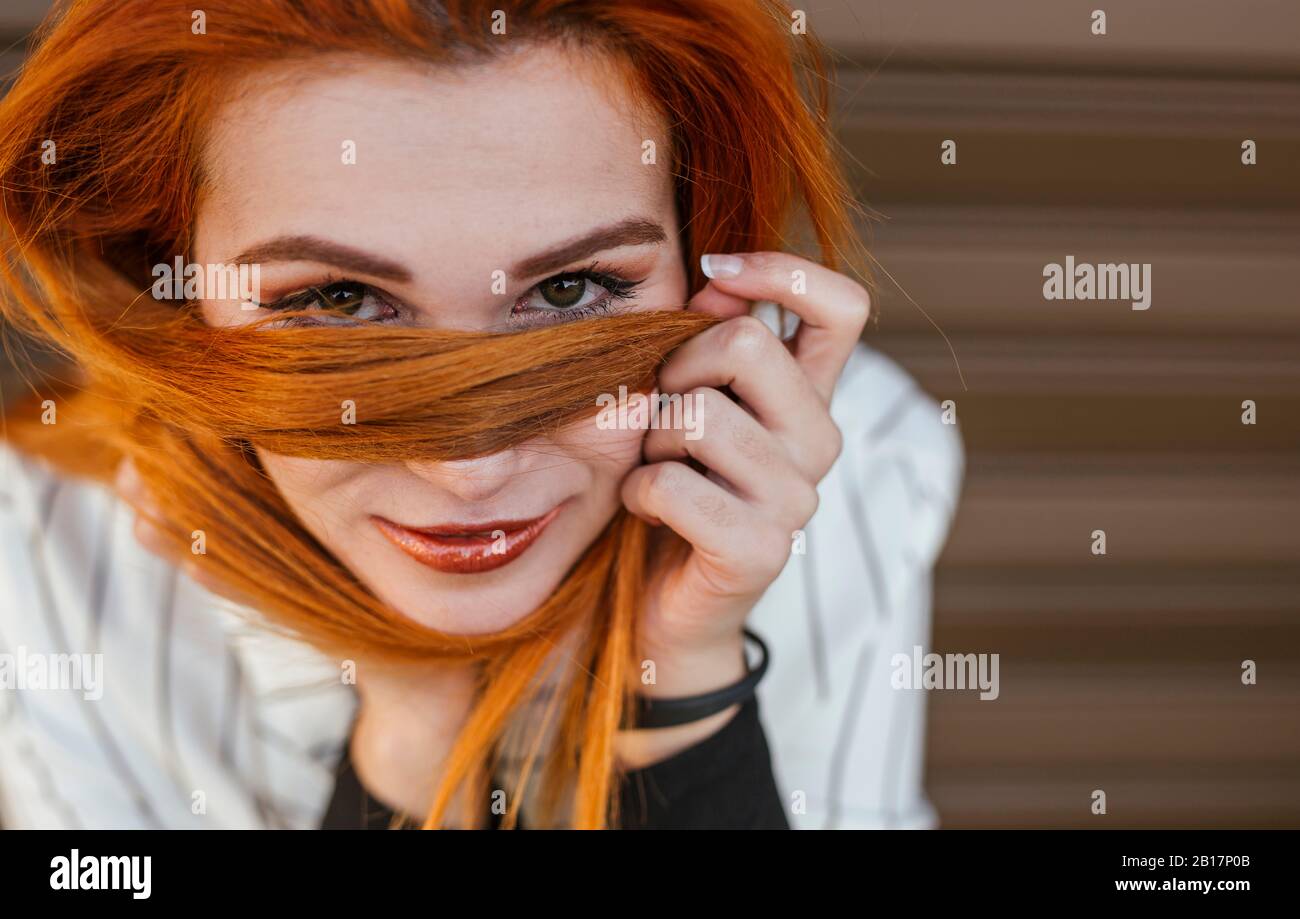 Portrait of redheaded young woman Stock Photo - Alamy