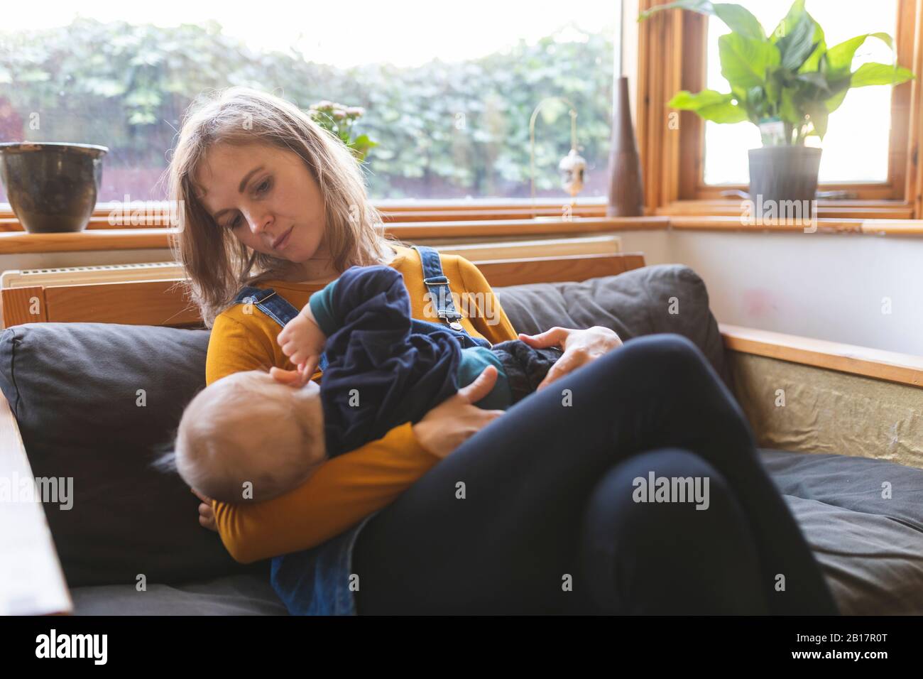 Mother and son on the sofa Stock Photo