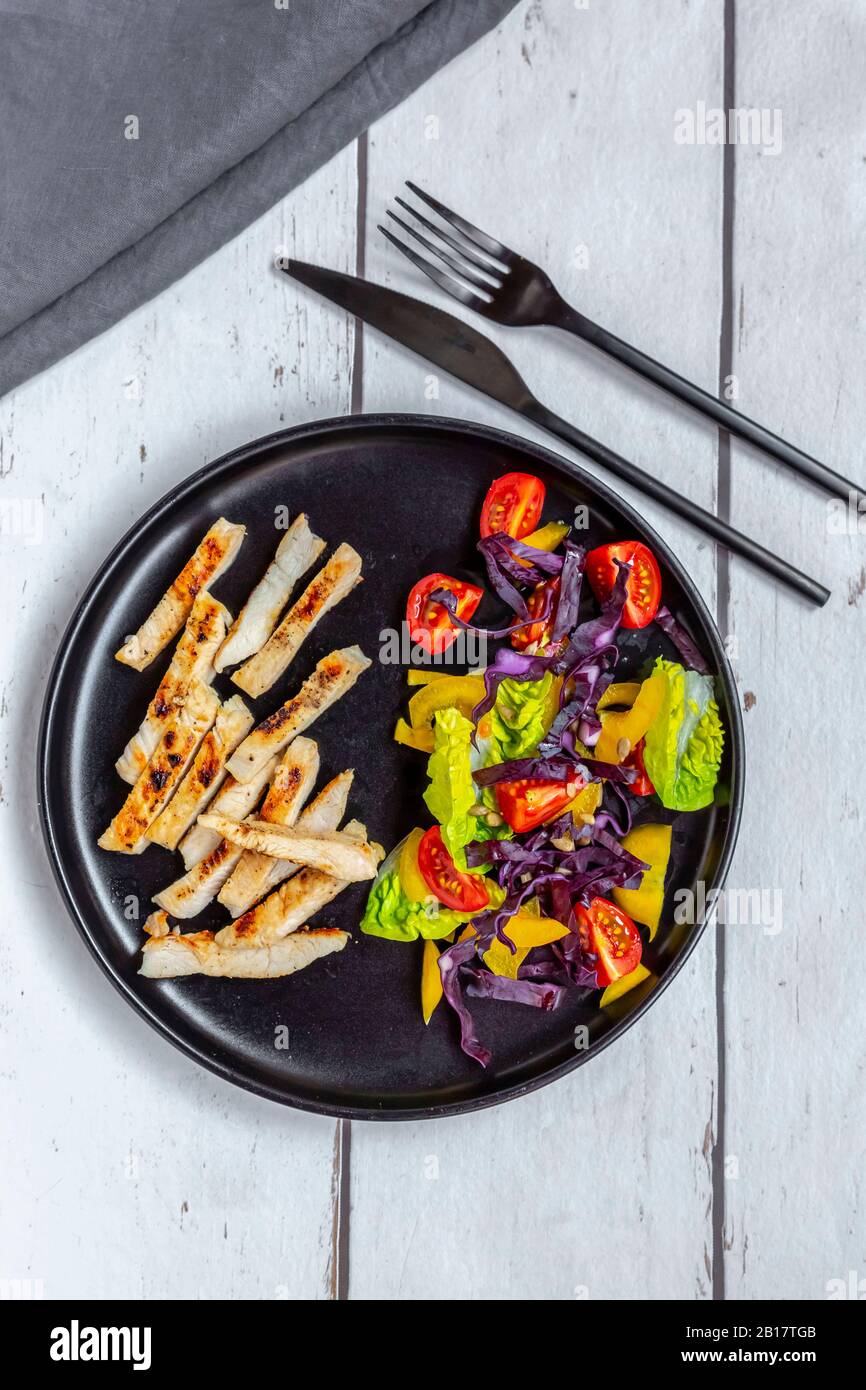 Turkey meat strips with vegetable salad Stock Photo