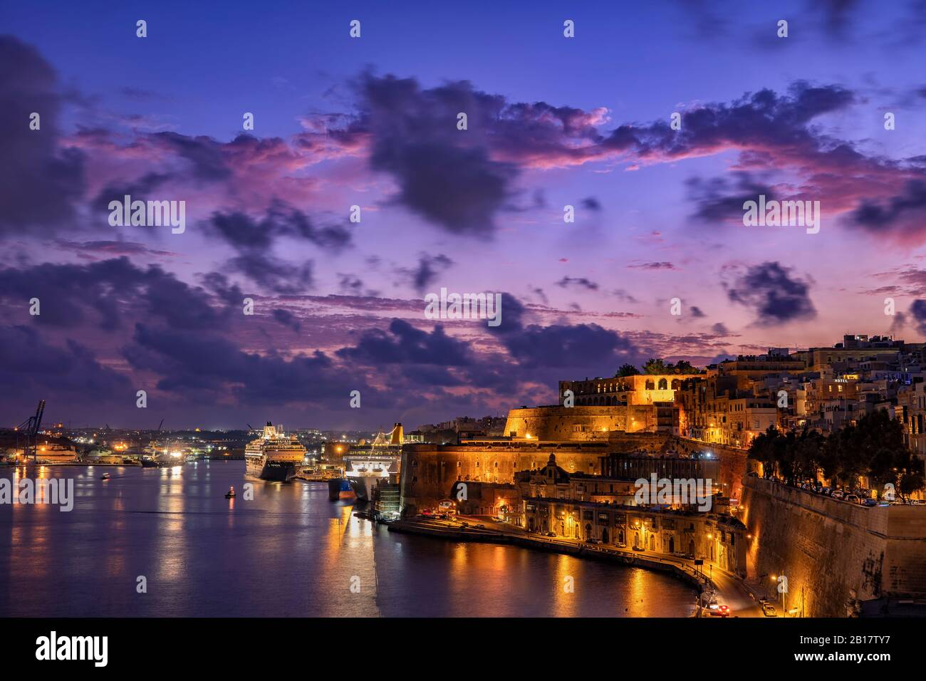 Malta, Valletta, Illumminated city and Grand Harbour at dusk Stock Photo