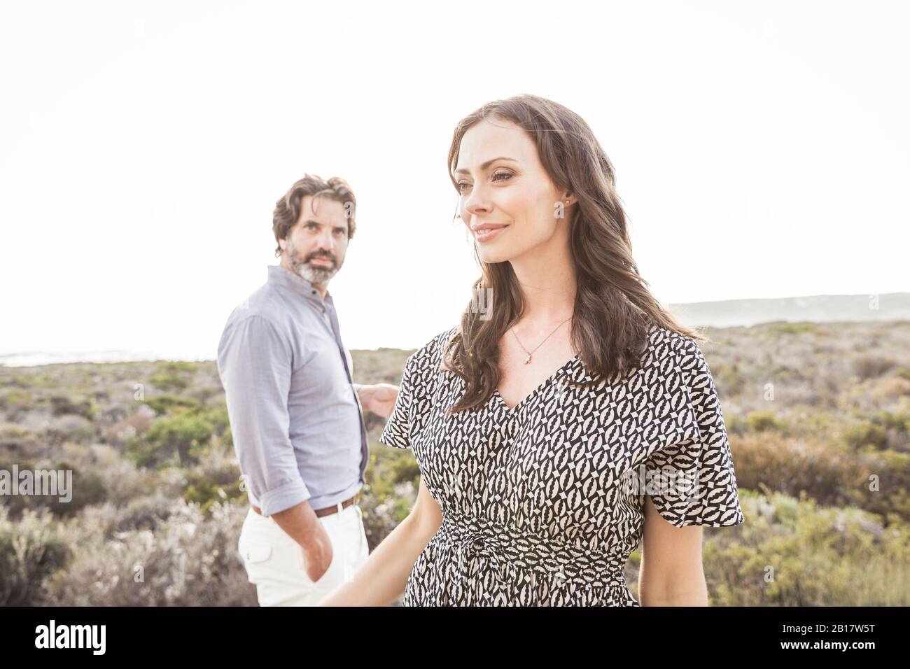 Couple standing outdoors hi-res stock photography and images - Alamy