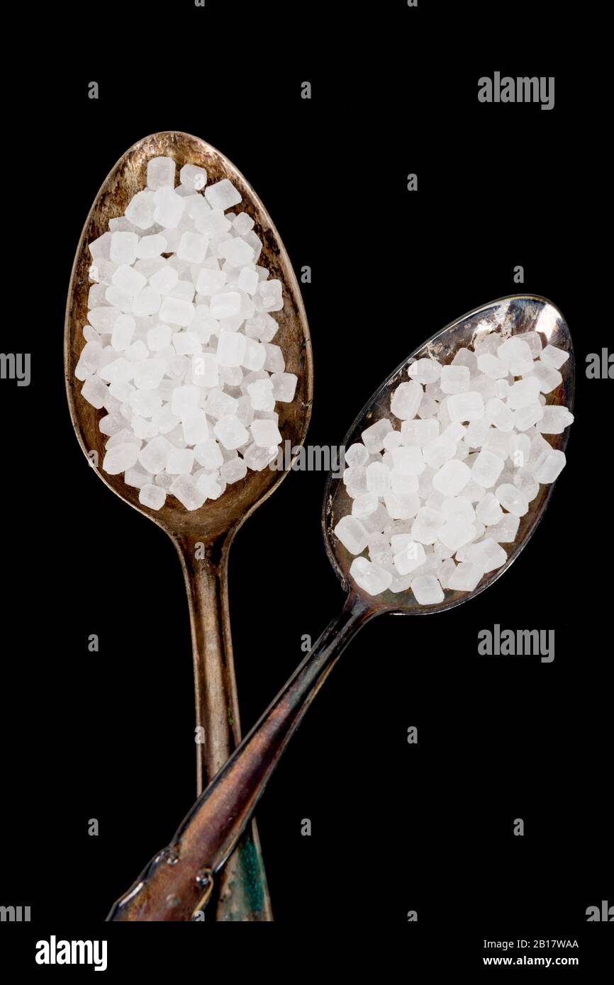 Studio shot of two old silver spoons of sugar Stock Photo