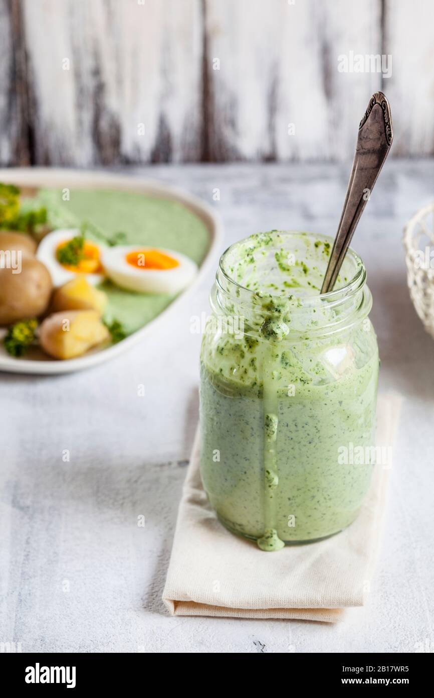 Jar of salsa verde sauce Stock Photo