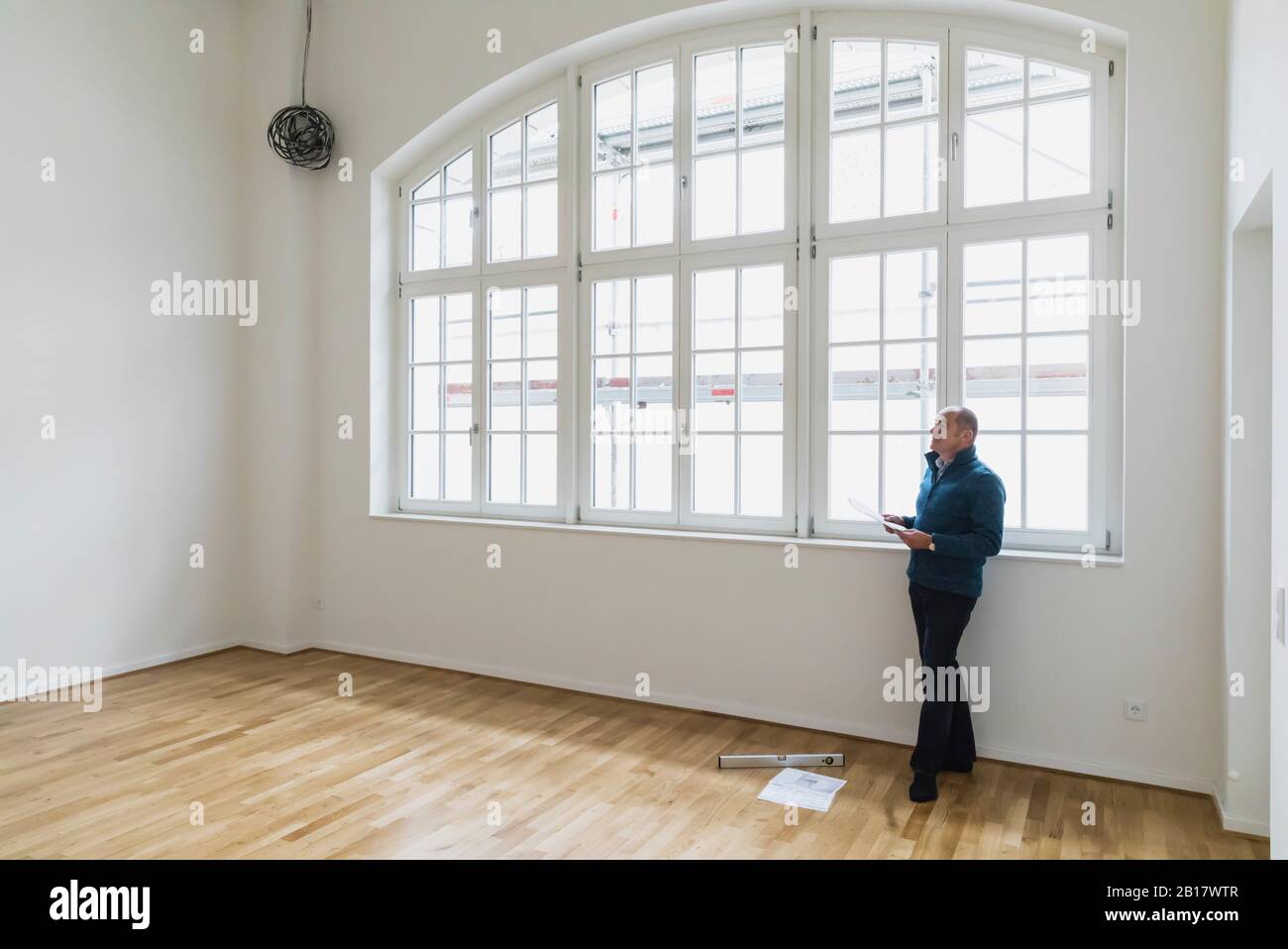 Man checking specifications of refurbished kuxury loft Stock Photo