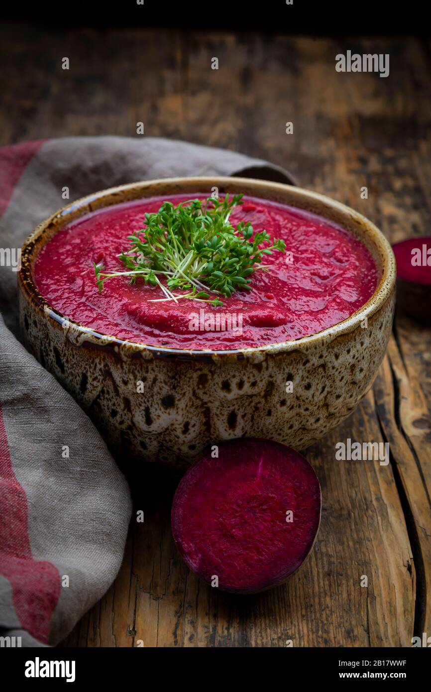 Bowl of vegan borscht with cress topping Stock Photo