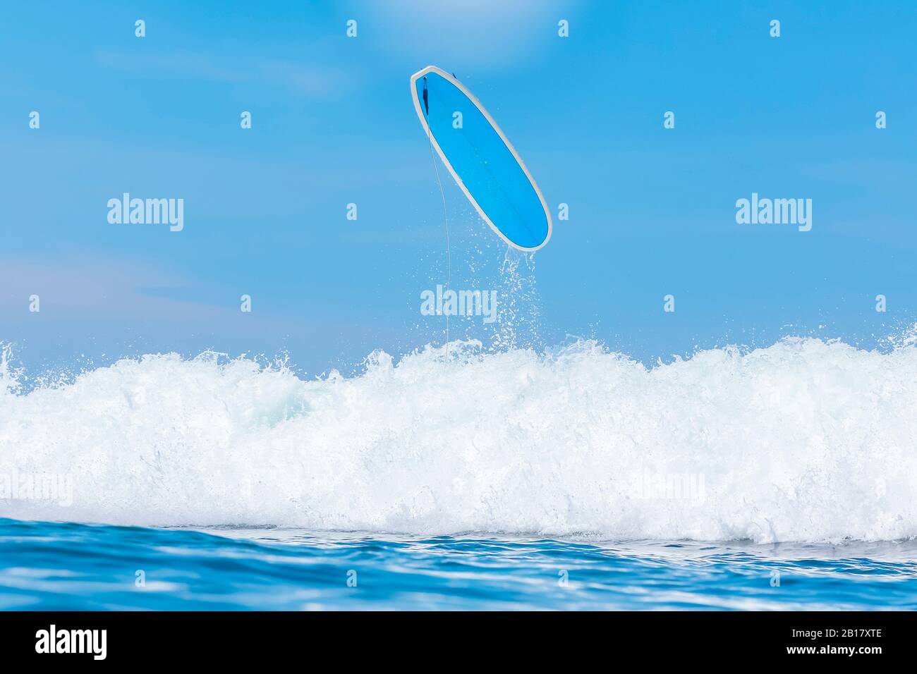 Indonesia, Bali, Surfboard over sea wave Stock Photo Alamy