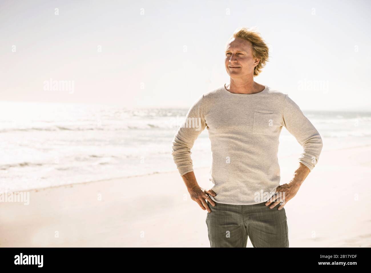 Smiling man standing at the coast hi-res stock photography and images ...