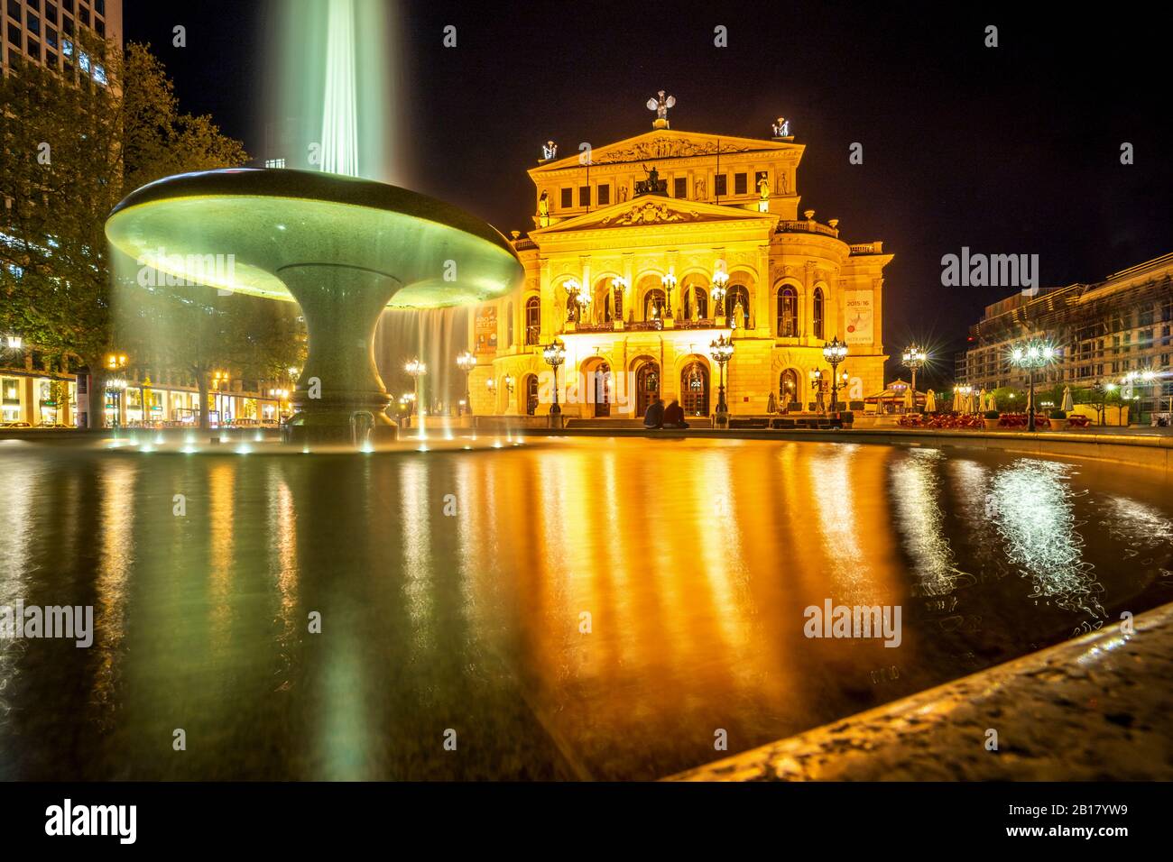 Germany, Hesse, Frankfurt, Fountain in front of Alte Oper at night Stock Photo
