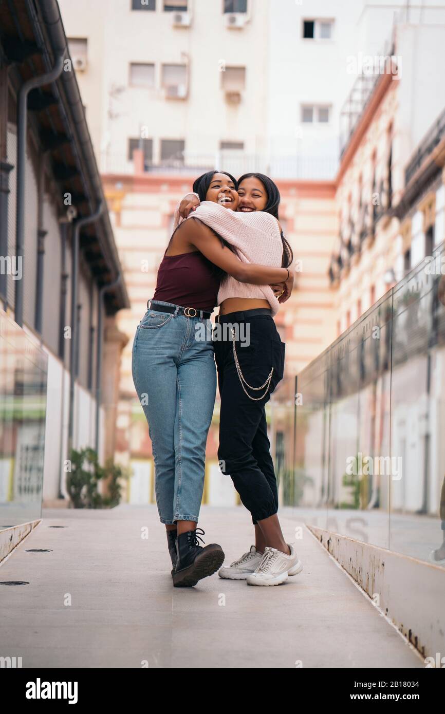 Women hugging hi-res stock photography and images - Alamy