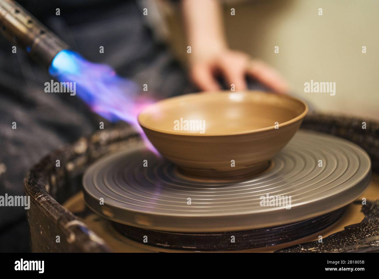 Close-up of potter working on workpiece Stock Photo