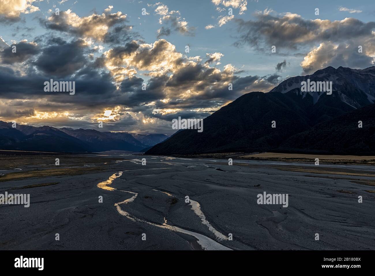 New Zealand, Grey District, Inchbonnie, Clouds over Waimakariri River in Arthurs Pass National Park at dusk Stock Photo