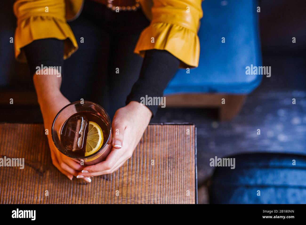 https://c8.alamy.com/comp/2B180NN/womans-hands-holding-glass-of-ice-cooled-beverage-2B180NN.jpg