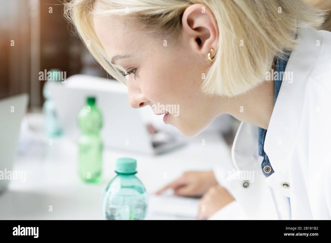 Portrait of female doctor in a meeting in hospital Stock Photo