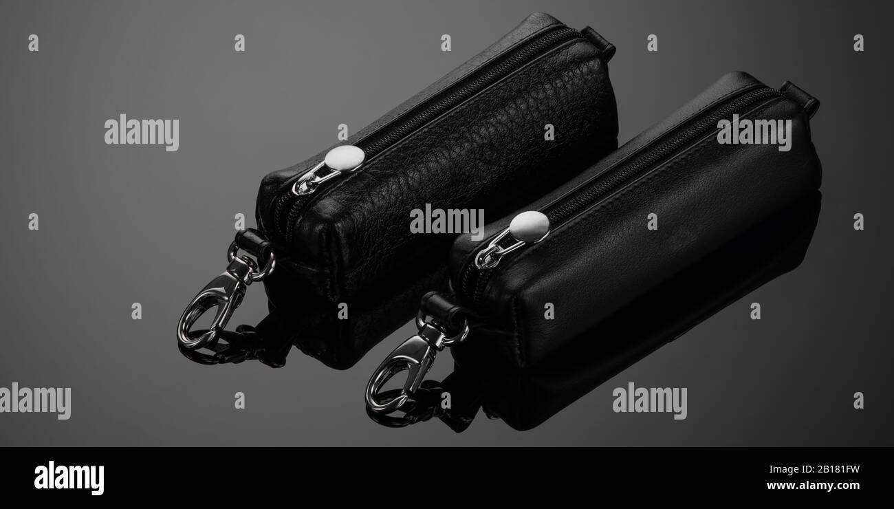 leather key case with zipper on black background Stock Photo
