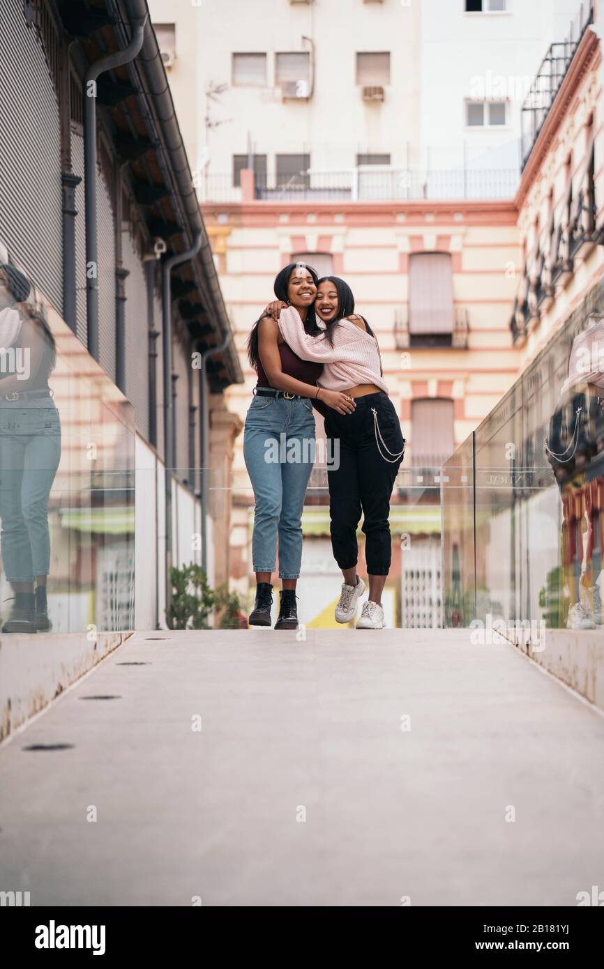 Two women hugging emotional hi-res stock photography and images - Alamy