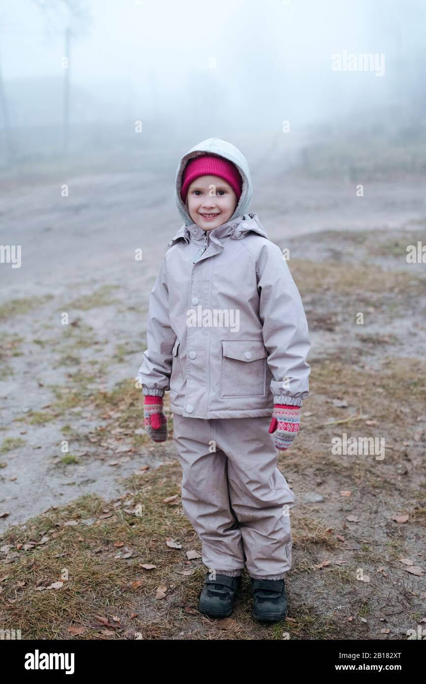 Portrait of smiling little girl in winter Stock Photo - Alamy