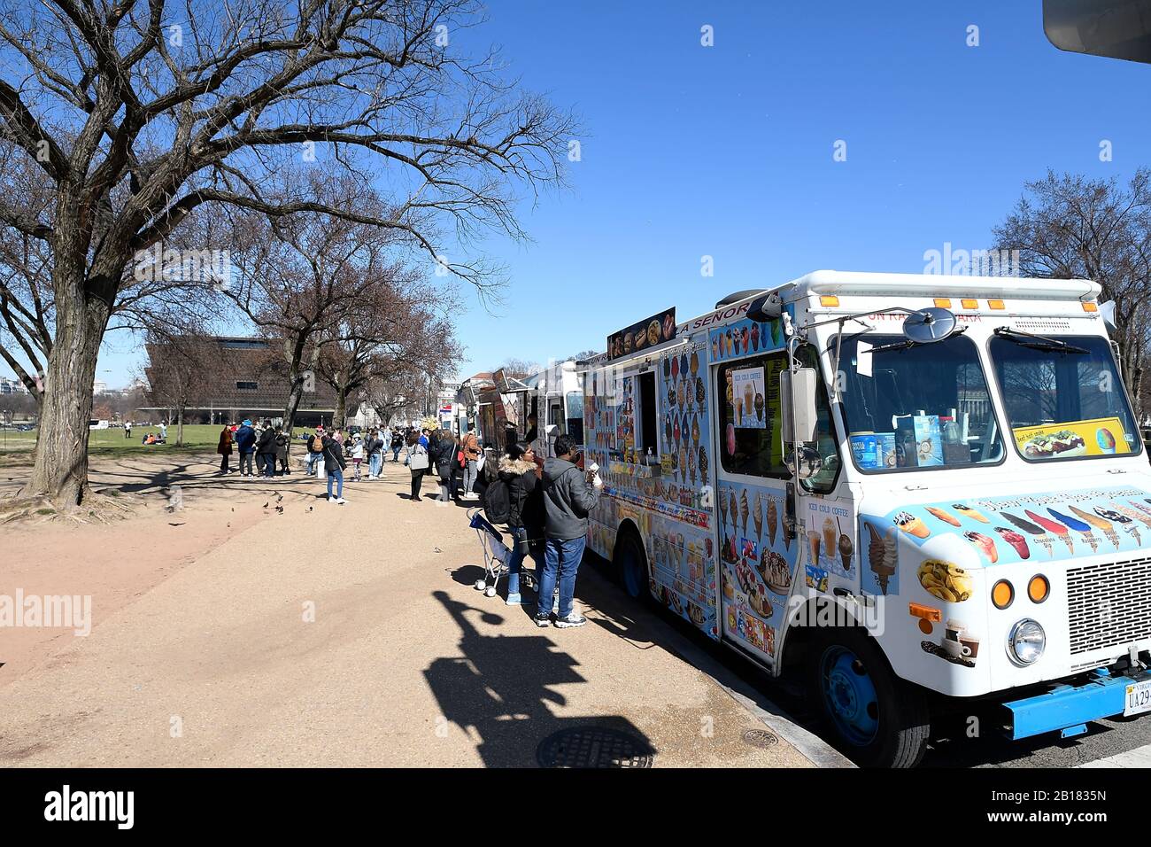 People buying food from food trucks lined up on 14th St in Washington DC Stock Photo Alamy