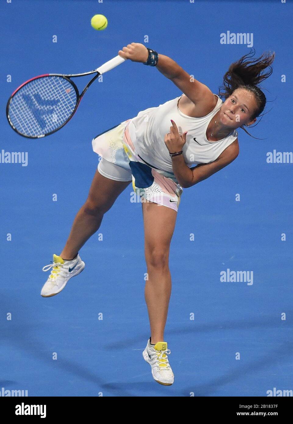 Doha, Qatar. 23rd Feb, 2020. Daria Kasatkina of Russia serves to Garbine  Muguruza of Spain during their women's singels first round match at 2020 WTA  Qatar Open tennis tournament in Doha, Qatar,