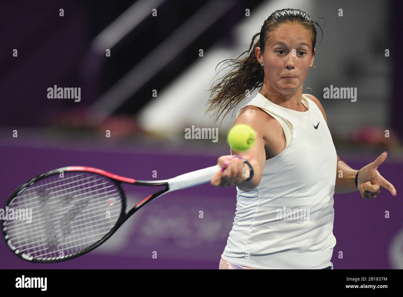 Doha, Qatar. 23rd Feb, 2020. Daria Kasatkina of Russia hits a return to  Garbine Muguruza of Spain during their women's singels first round match at  2020 WTA Qatar Open tennis tournament in