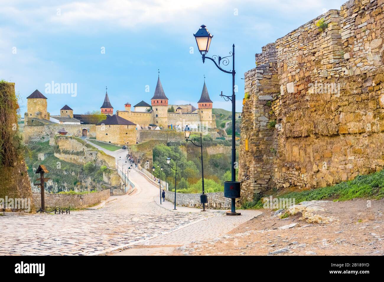 Old medieval castle of Kamenetz-Podilsk town, Ukraine, historical monuments, day view. Spiers of the castle. Forged lanterns near old historical part of the city. Travel background. Tourism, tour Stock Photo
