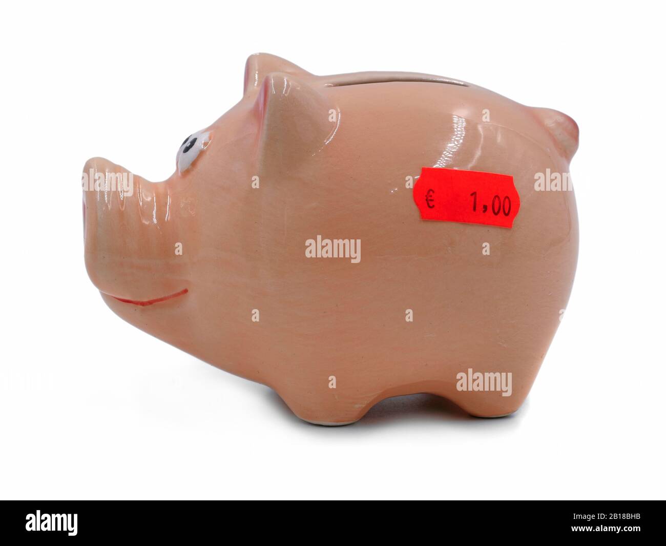 side view of piggy bank with red price label for one euro isolated on ...