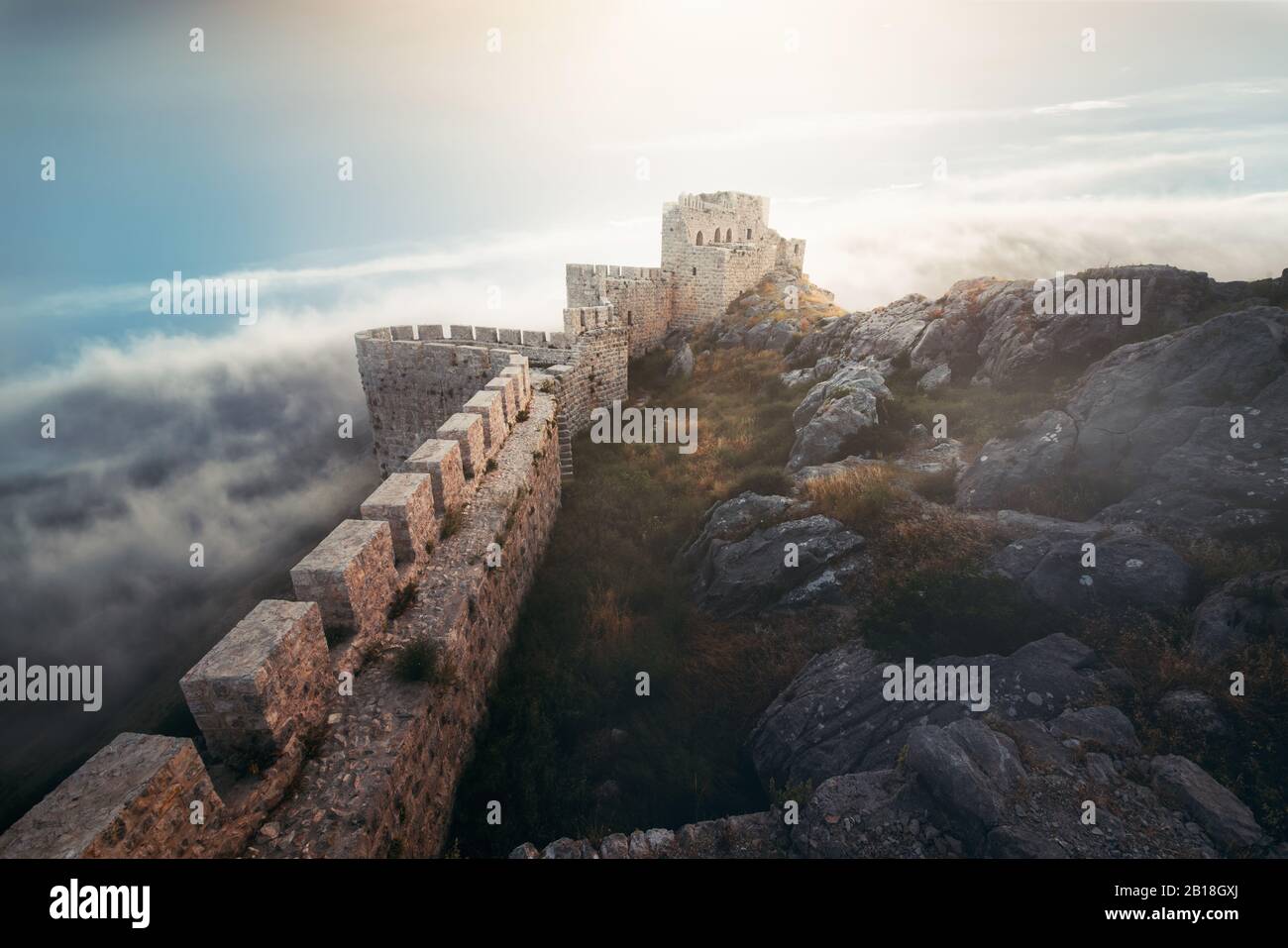 Medieval fortress, wall and tower landscape with cloudy sky Stock Photo Alamy