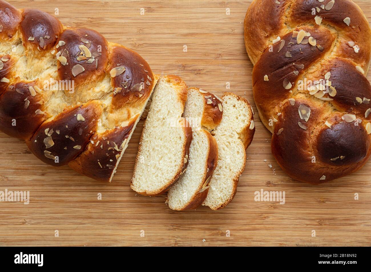 Sweet bread, easter tsoureki cozonac sliced on wood table background