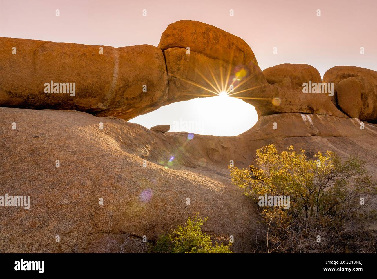 Rock arch at sunset in the Spitzkoppe National Park in Namibia. Stock Photo