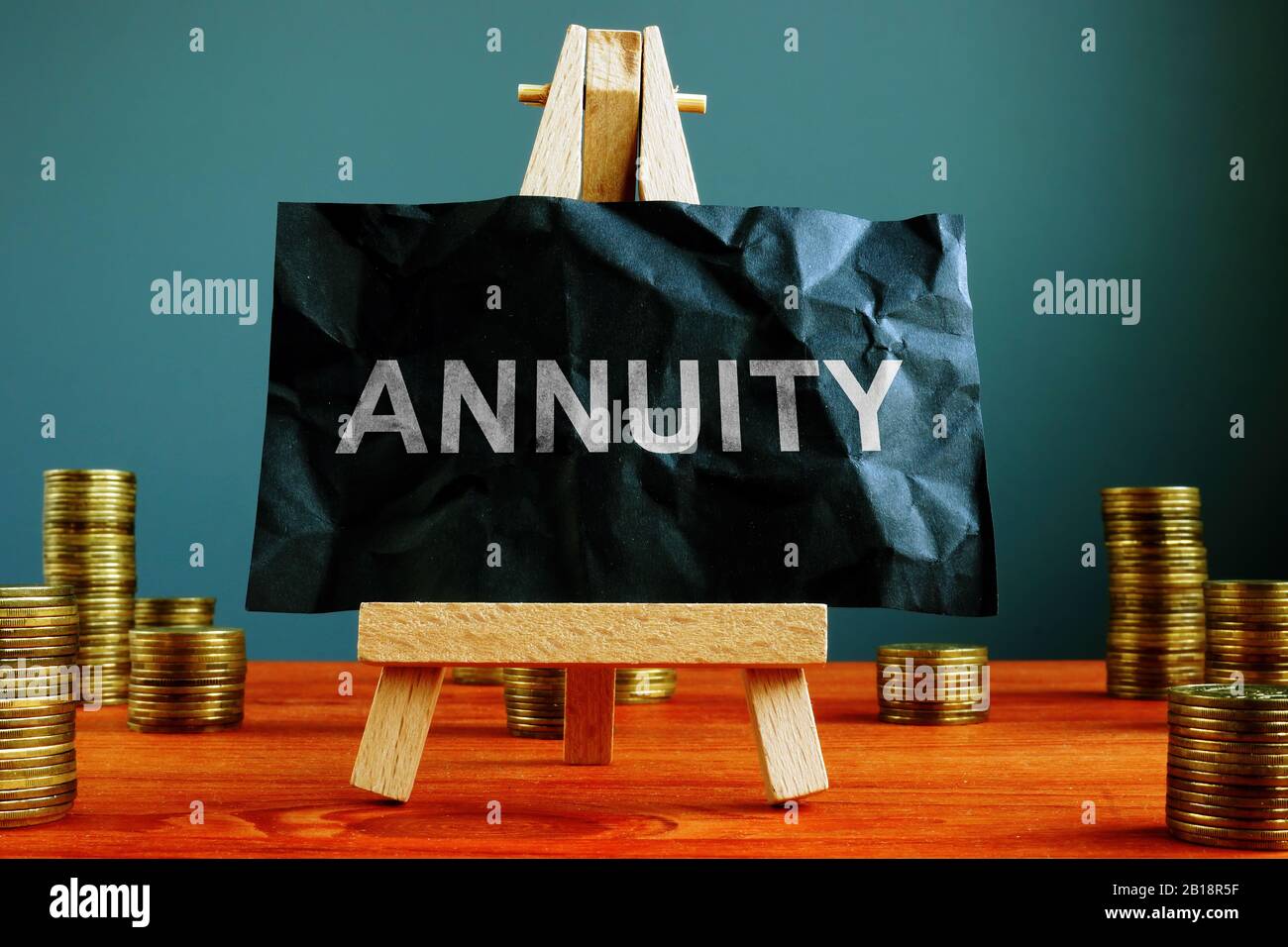 Annuity sign on the black sheet ans coins Stock Photo - Alamy