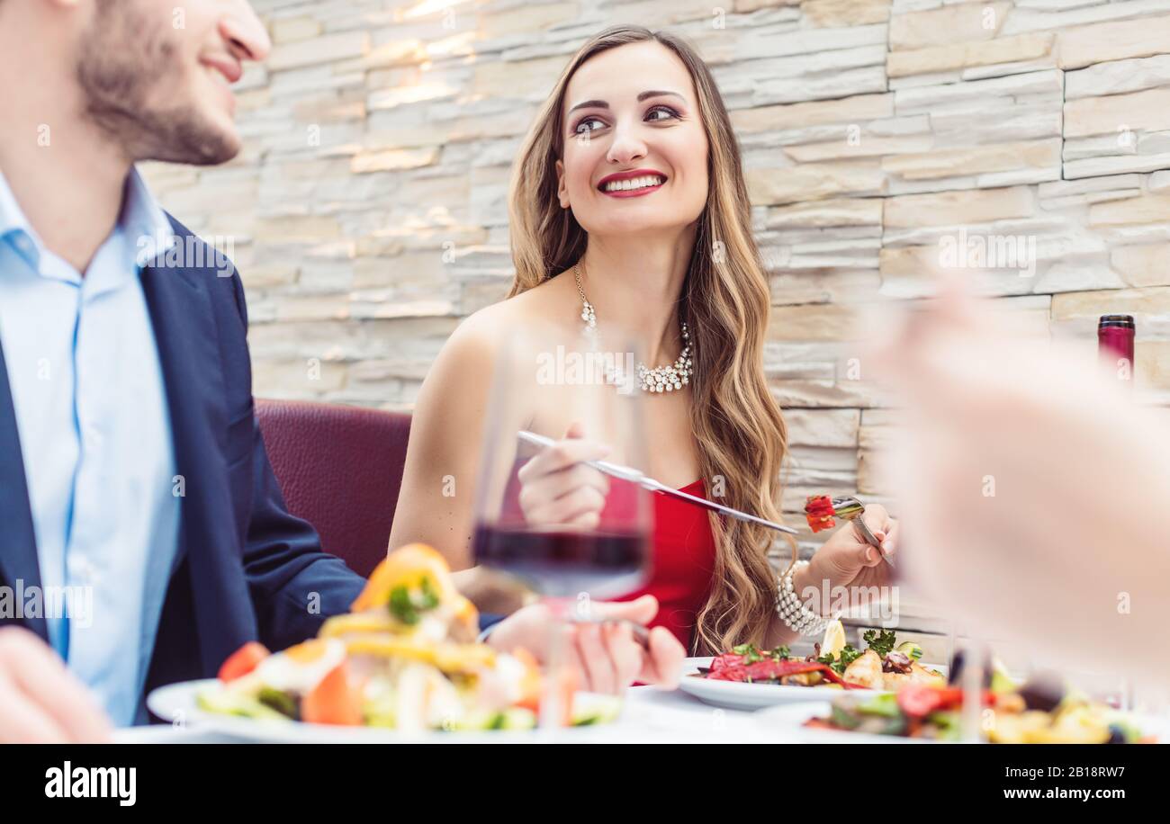 Patrons of Italian restaurant eating, drinking and chatting Stock Photo