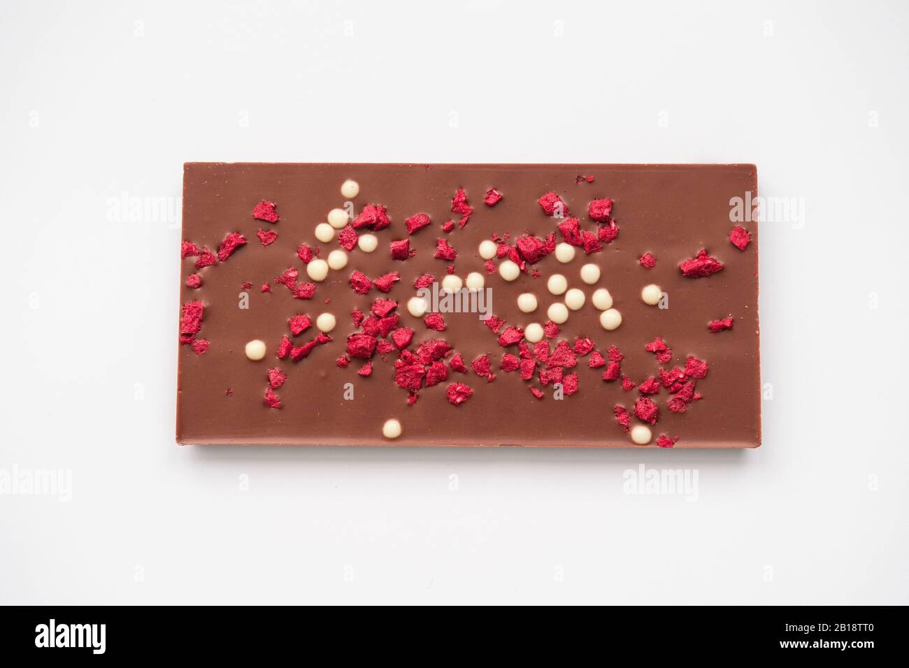 Chocolate bar with dried raspberries and rice chips Stock Photo - Alamy