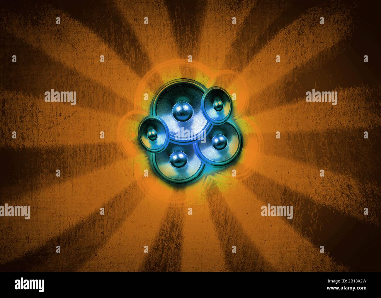 Blue audio speakers on a yellow sunburst background with vignette Stock Photo