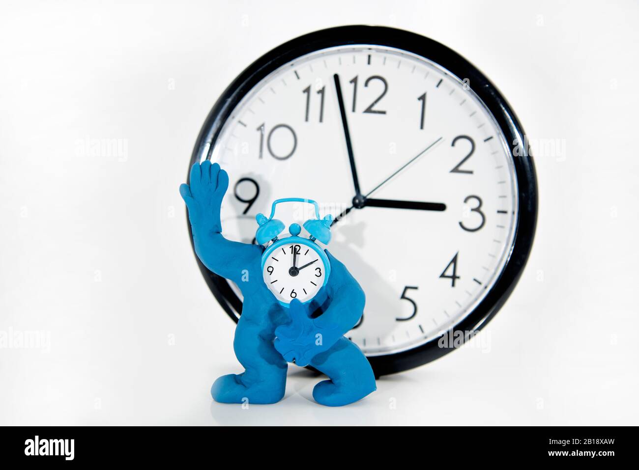 Funny ClockMan made from Play Clay. Isolated on white background Stock