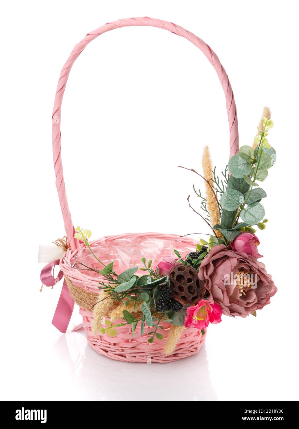 Pink Wicker basket decorated with flowers on white background Stock ...