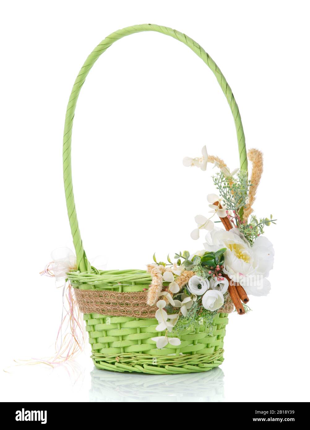 Wicker basket decorated with flowers on white background Stock Photo ...