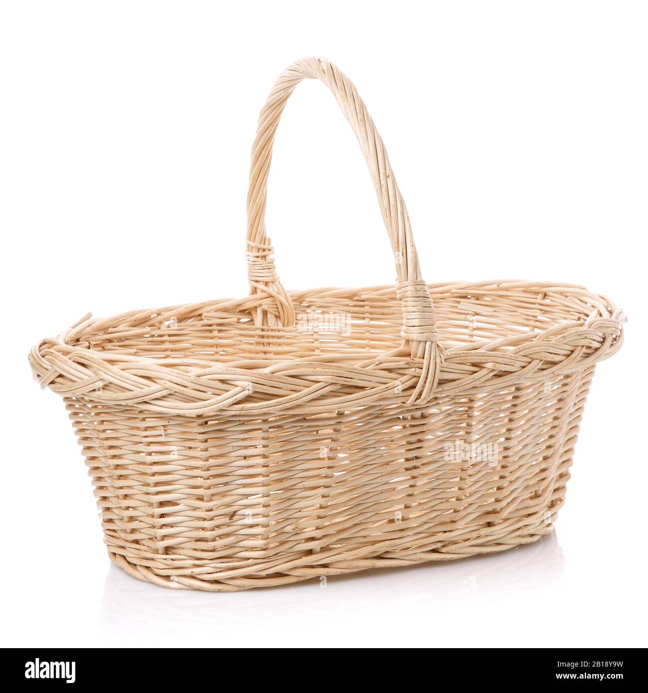 Rustic wicker basket isolated on white background Stock Photo - Alamy