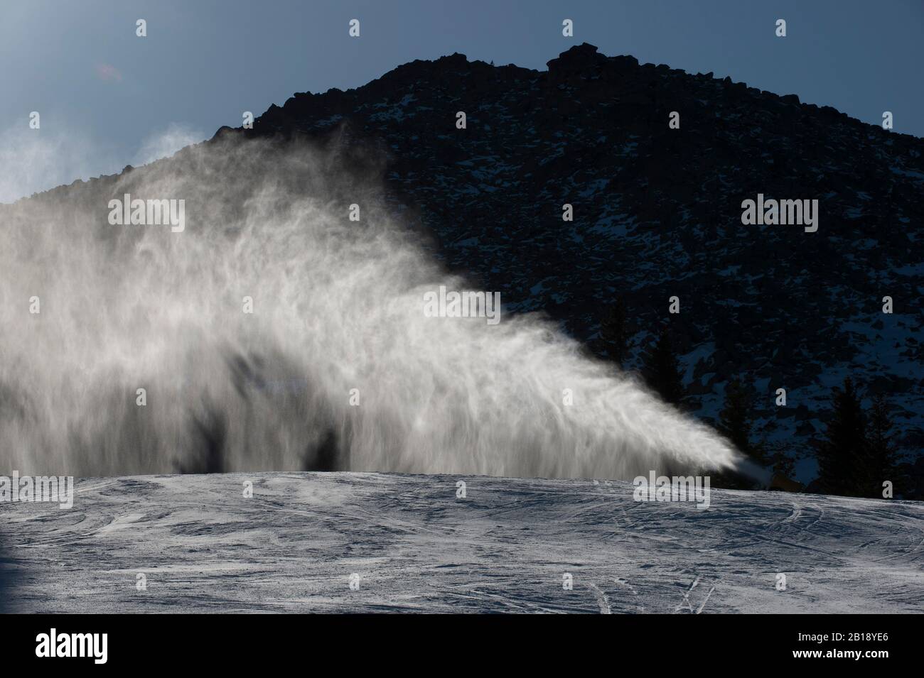 Ski slope with artificial snow machine Stock Photo - Alamy