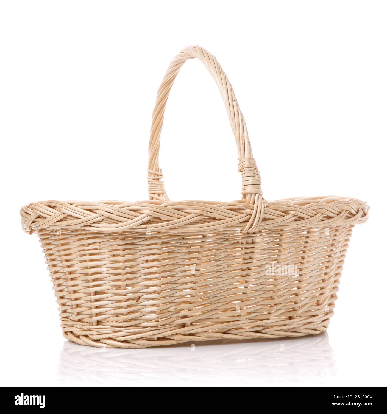 Rustic wicker basket isolated on white background Stock Photo - Alamy