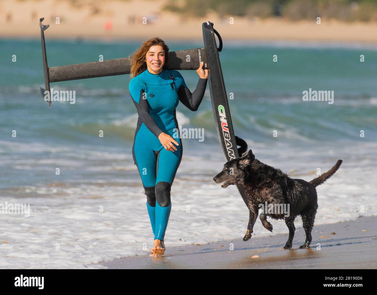 Woman with a kitesurfing racing foil board. Stock Photo