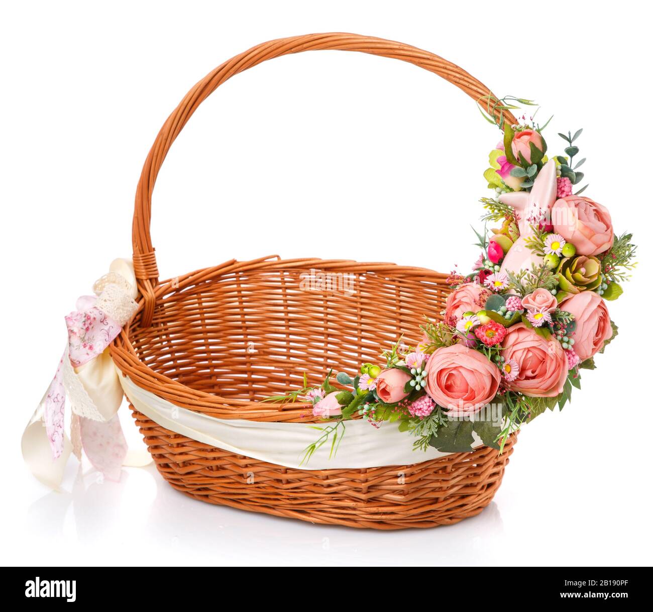 Wicker basket decorated with flowers on white background Stock Photo ...
