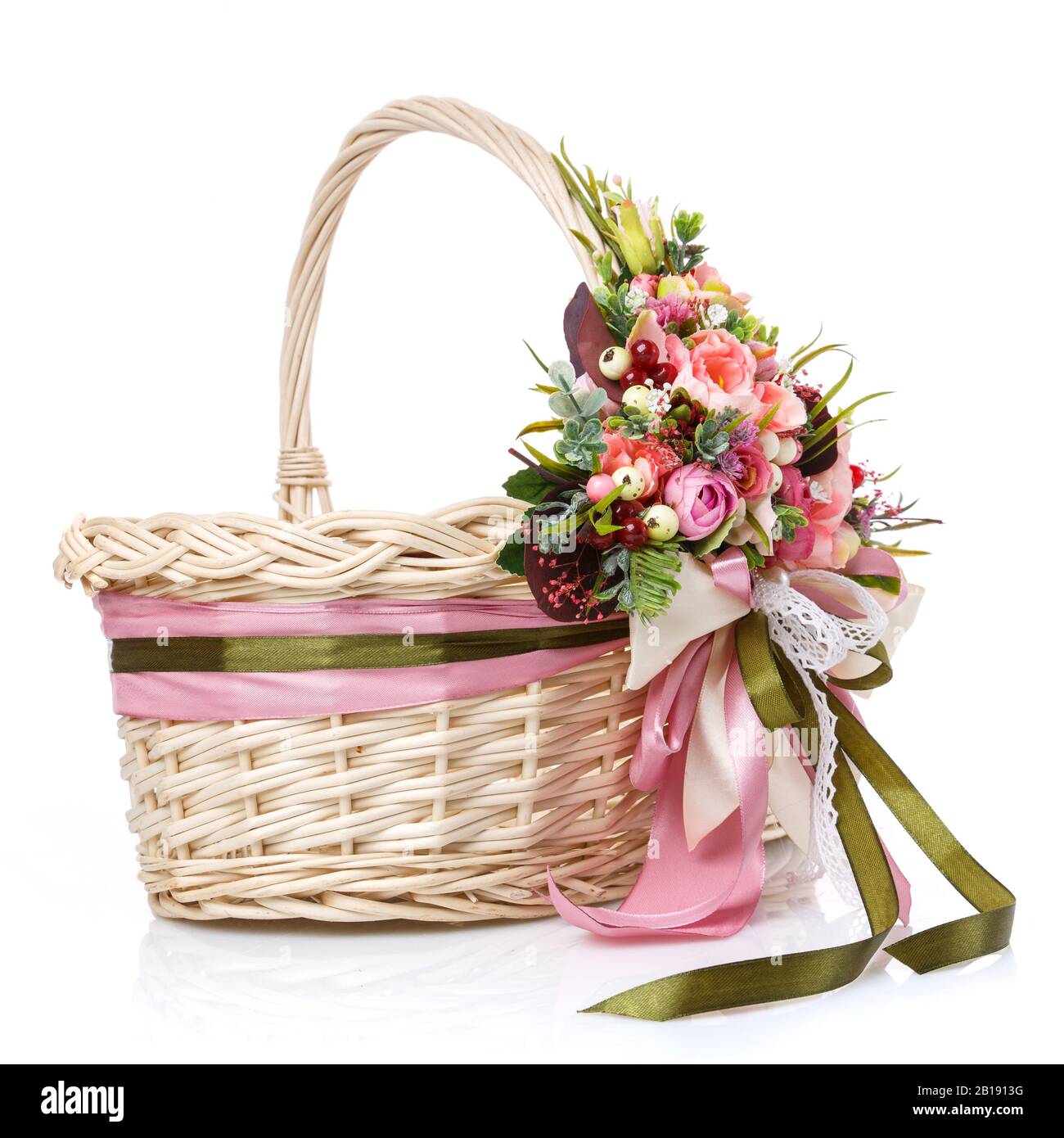 Wicker basket decorated with flowers on white background Stock Photo ...