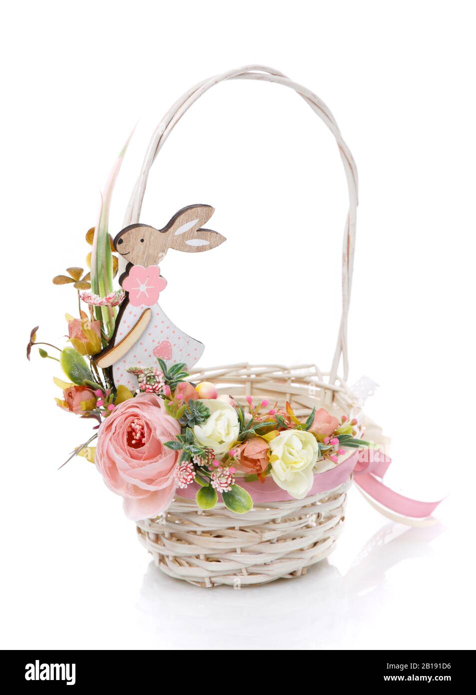Little white round wicker basket with high handle. Basket decorated with delicate pink floral