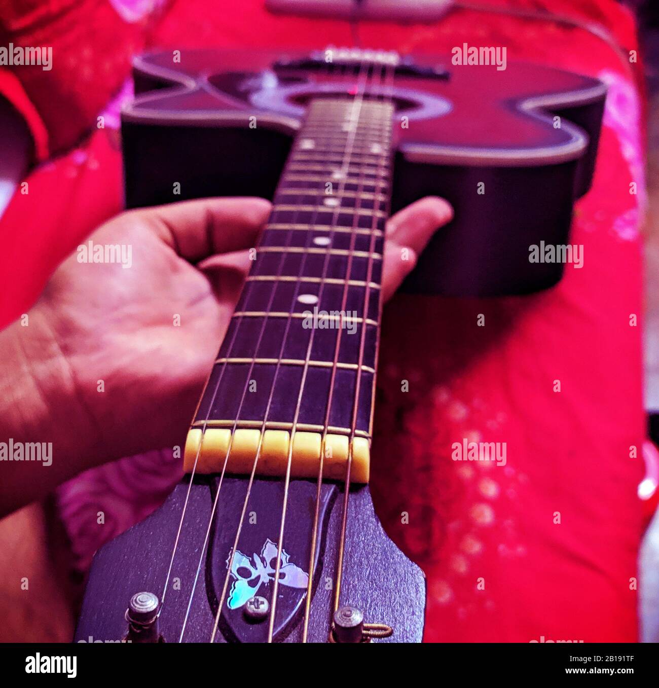 Guitar close up view isolated on hand. Music Recording studio equipment