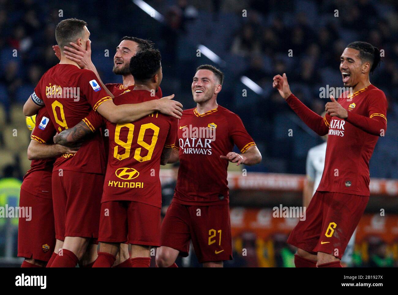 Rome, Italy. 23rd Feb, 2020. Roma s Edin Dzeko, left, is congratulated by his teammates after scoring during the Serie A soccer match between Roma and Lecce at the Olympic Stadium. Credit: Update Images/Alamy Live News Stock Photo