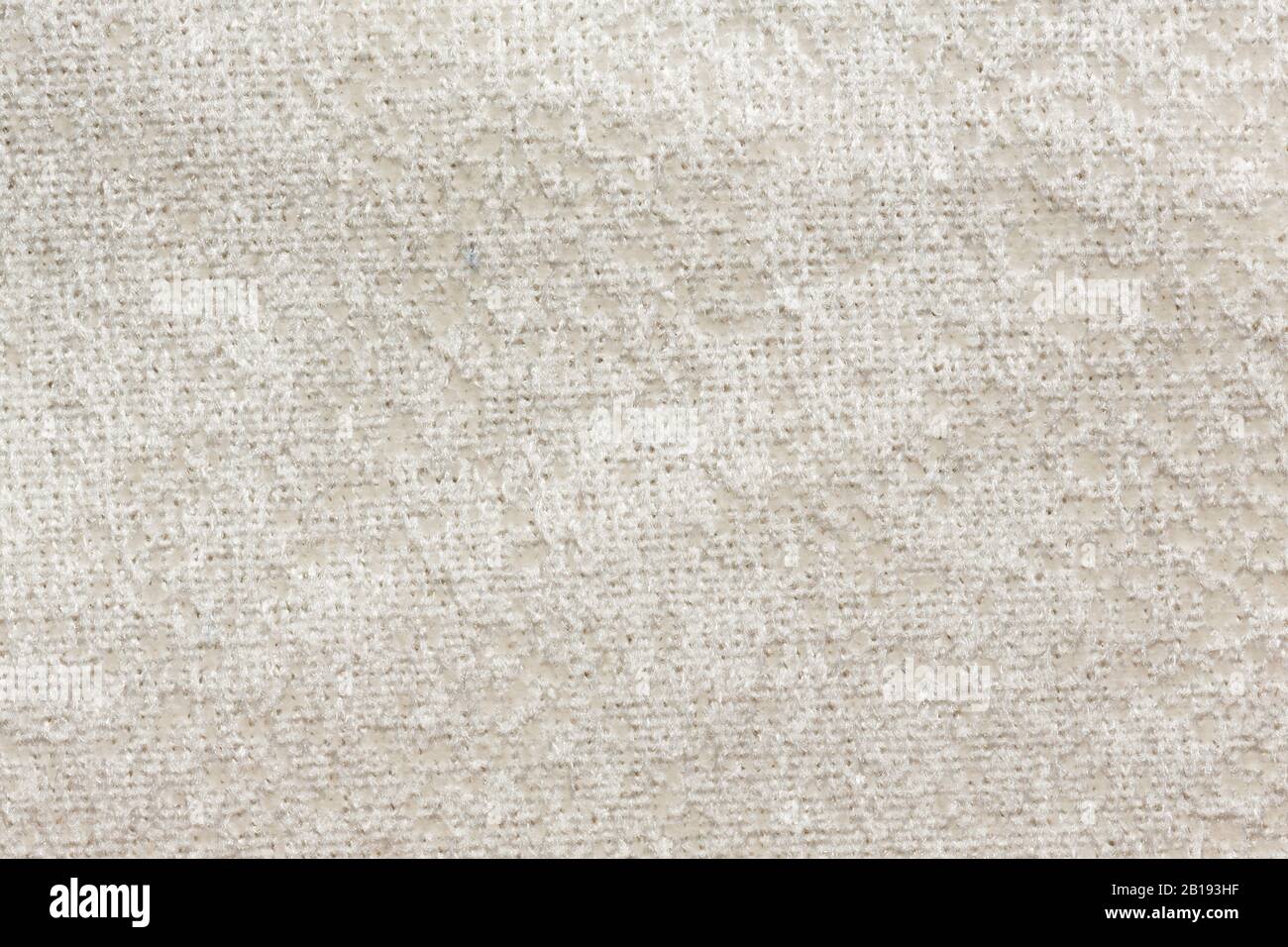Relief textile background with clean white surface. Stock Photo